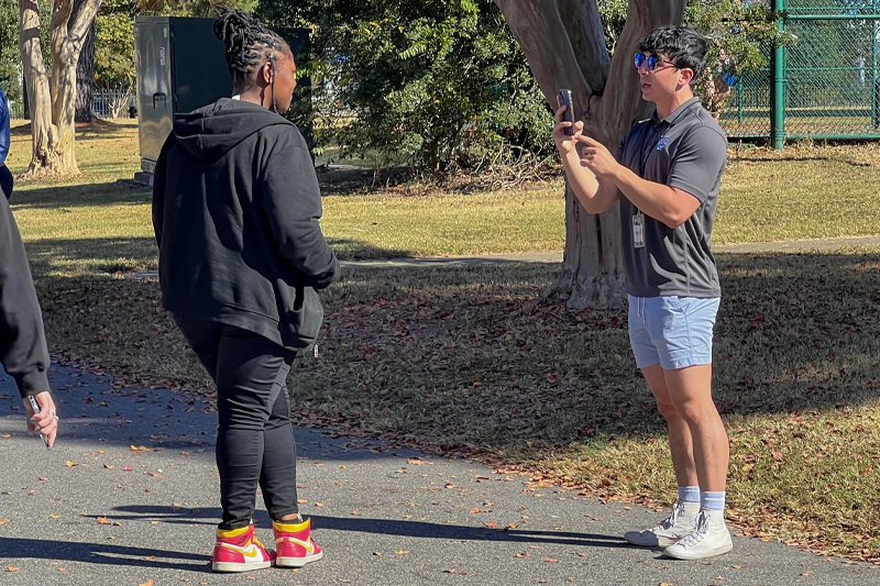 Noah Shubert '25 (right) interviewing voters at the precincts.