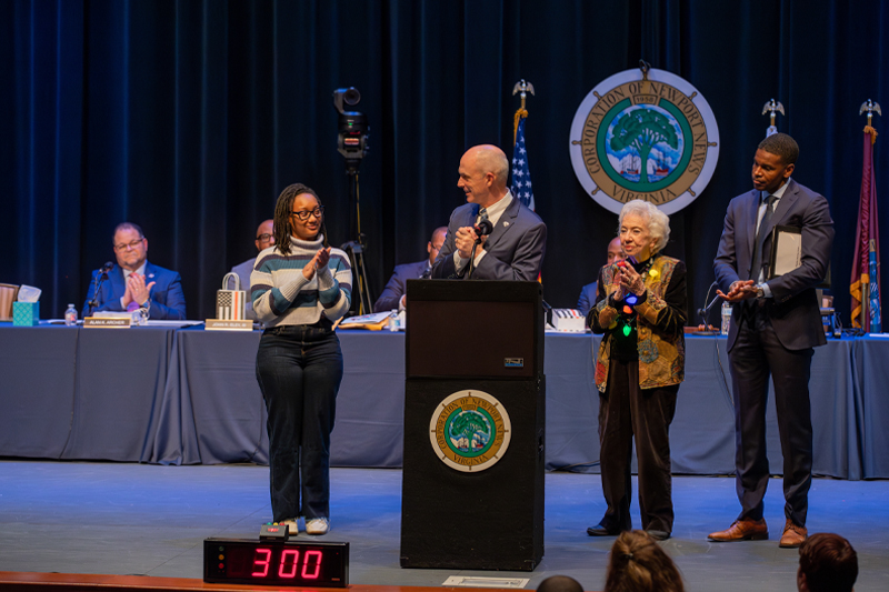 President Kelly on stage with Community Captains and Mayor Phillip Jones