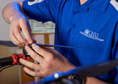 close up photo of hands working on a drone