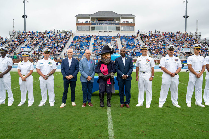 CNU Provost Quentin Kidd, President Bill Kelly, Hampton University President Darrell Williams stand at midfield at TowneBank Stadium