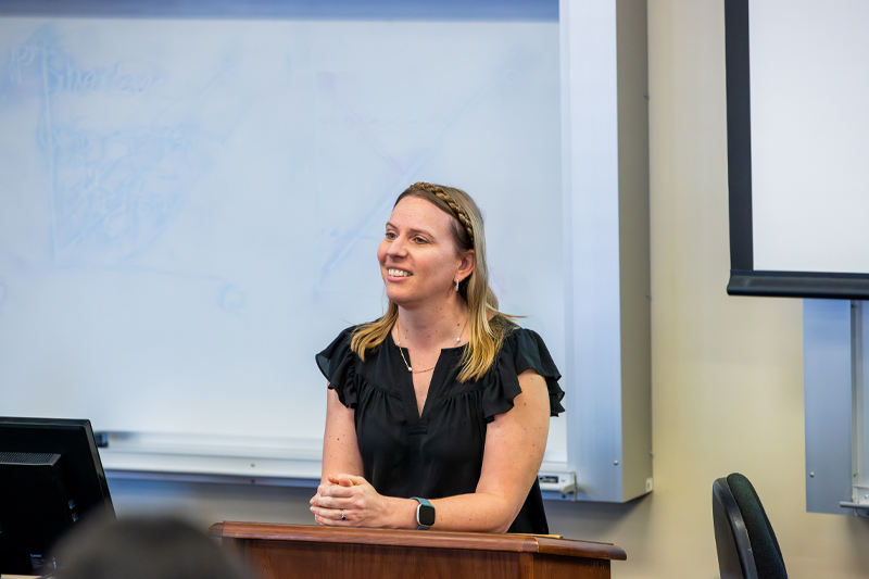 Dr. Rebecca Bromley-Trujillo smiling in classroom