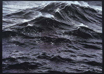 Black and white turbulent, dark ocean waves with white sea form cresting  under a moody sky.