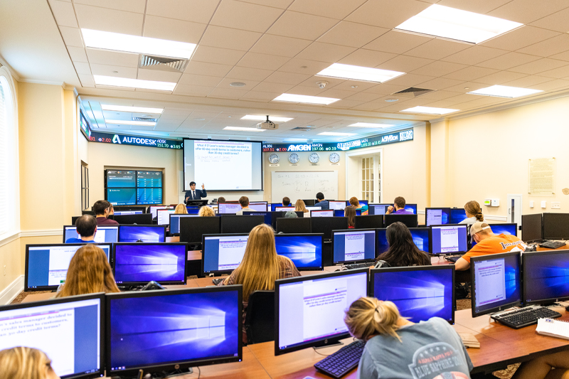 Students sitting at computers in a classroom